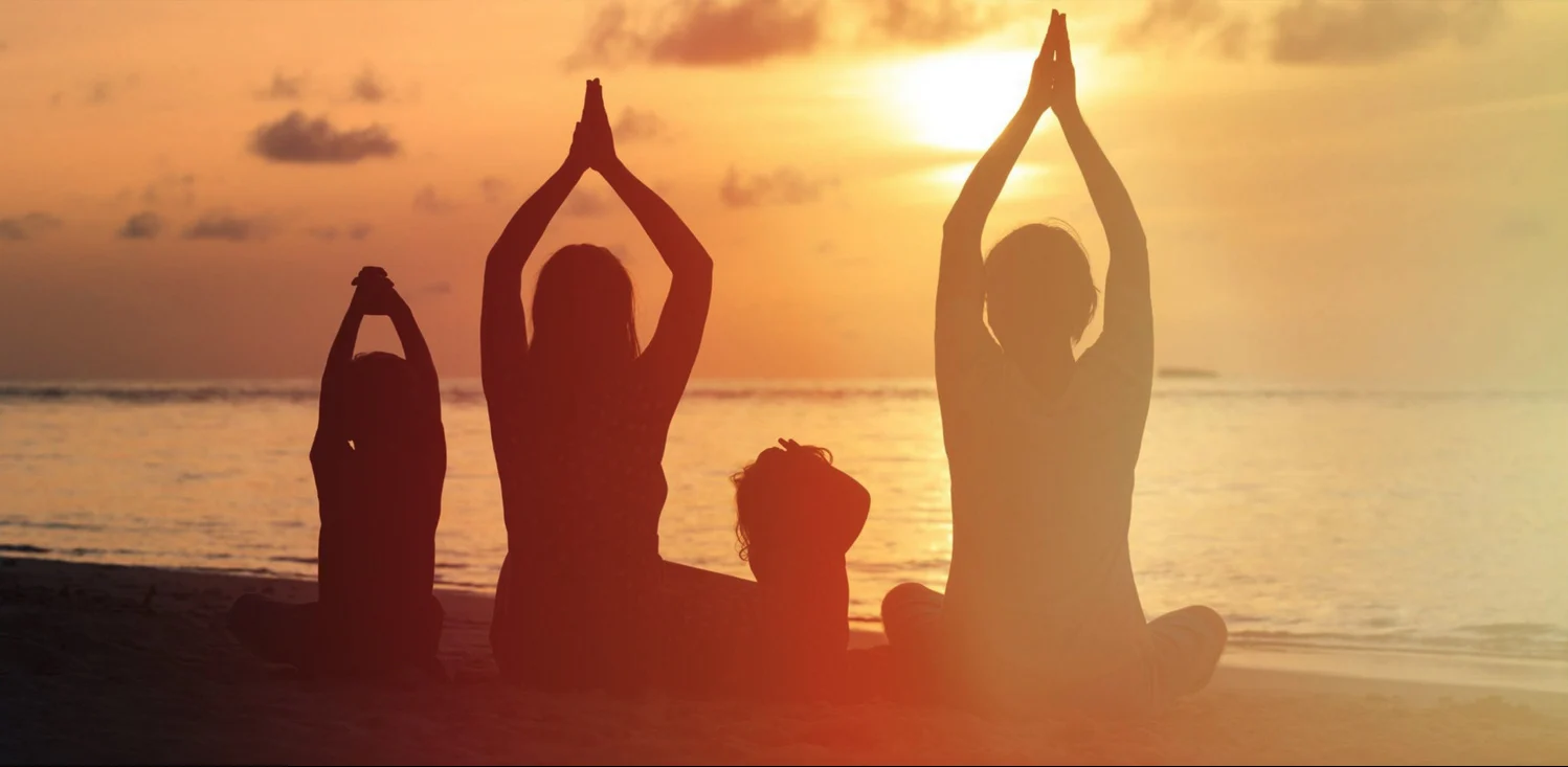 family-yoga-beach-healing-energy